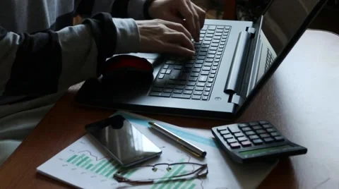 Businessman thinks on the calculator Stock Footage 67609370
