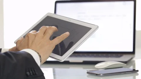Businessman with three devices Video stock 104600654
