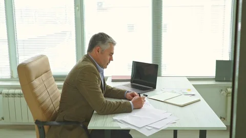 The businessman throwing papers at the office table. slow motion Stock Footage 105204067