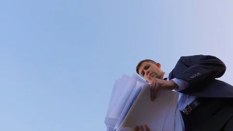 Businessman throws up documents Stock Footage 77601472