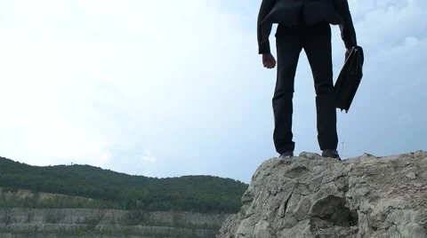 Businessman throws his hands in the direction of enjoying the freedom Stock Footage 66910627