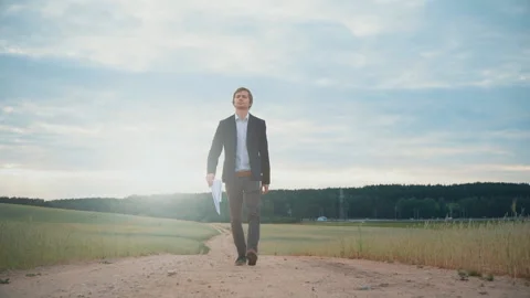 Businessman throws papers and documents into the air in the middle road in the Stock Footage 91329196