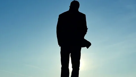 Businessman throws the papers slow motion on sunny sky background Stock Footage 69878959