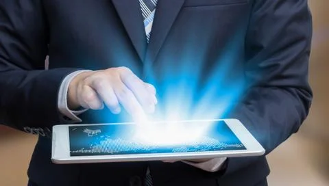 Businessman touch on screen tablet technology concept and ecommerce Stock Photos