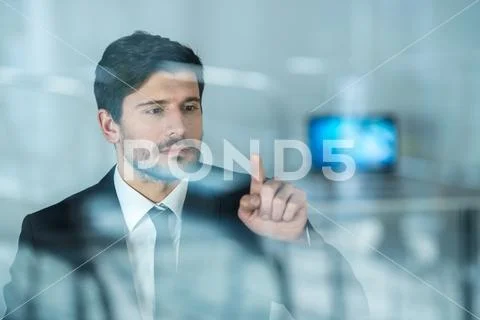 The businessman touch the virtual screen Stock Photos