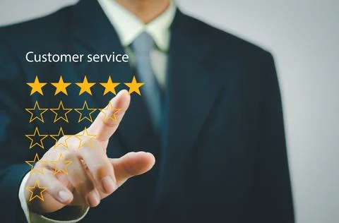 Businessman touching button to select five stars.Customer satisfaction and ma Foto stock