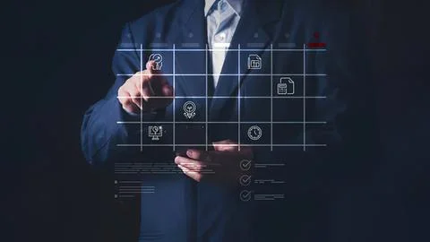 Businessman touching digital interface with icons and charts Stock Photos