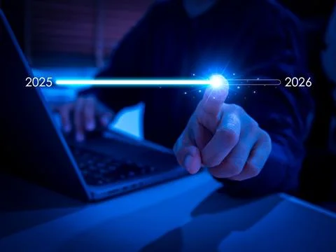 Businessman touching digital progress bar from 2025 to 2026 on virtual scre.. Stock Photos
