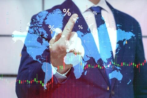 Businessman touching digital world map with stock market candlestick charts.. Stock Photos