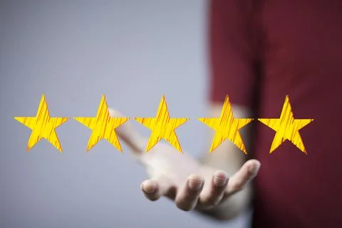 Businessman touching technology interface with ranking stars Stock Photos