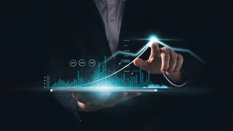 Businessman touching virtual screen Analyzing financial and investment data.. Stock Photos