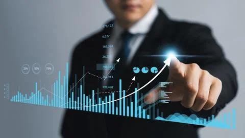 Businessman touching virtual screen Graph analysis of business growth and i.. Stock Photos