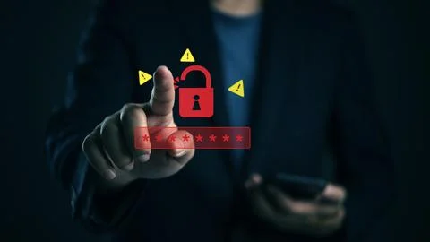 Businessman touching virtual screen with red open padlock icon and warning .. Stock Photos