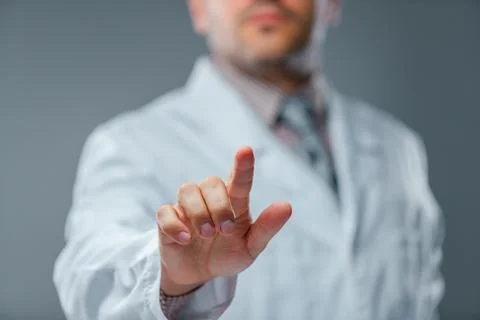Businessman touching virtual screen, user interface and business technology.. Stock Photos