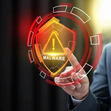 Businessman touching a virtual shield displaying a malware warning, represe.. 写真素材