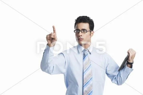 Businessman touching a visual screen and holding a digital tablet Stock Photos