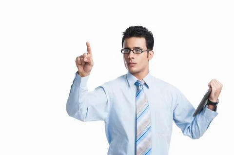 Businessman touching a visual screen and holding a digital tablet Stock-Fotos
