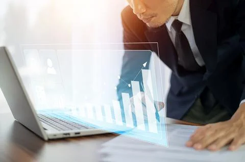 Businessman trader use computer  virtual screen stock market and investment t Stock Photos