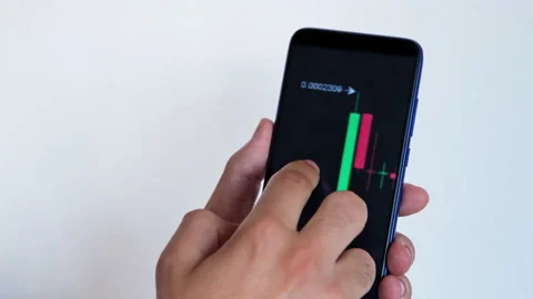 Businessman trader using mobile app monitoring price changes Stock Footage 156944460