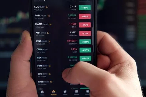 Businessman trader using smartphone checking stock exchange. Man using mobile Stock Photos