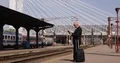 Businessman in Train Station With Luggage in Hand Looking to Wristwatch 4k or 4k+ Resolution