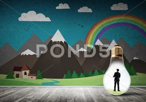 Businessman trapped in bulb Stock Photos