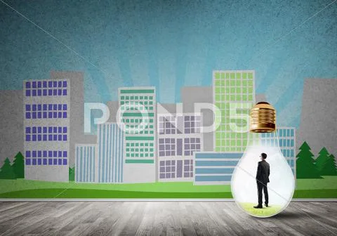 Businessman trapped in bulb Stock Photos