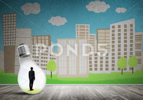 Businessman trapped in bulb Stock Photos