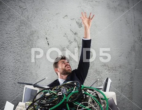 Businessman trapped by cables. concept of stress and overwork Stock Photos