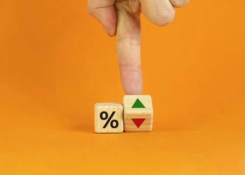Businessman turns a cube, changes the direction of an arrow symbolizing that  Stock Photos