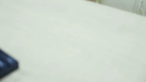 Businessman typing on the computer and talking on the phone Stock Footage 83763507