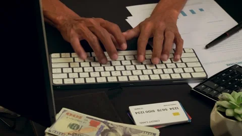 A businessman is typing on a computer keyboard and browsing the internet, s.. Stock Footage 308863476