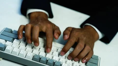 Businessman typing on computer keyboard, Close-up of a businessmans hands t.. Stock Footage 348345054