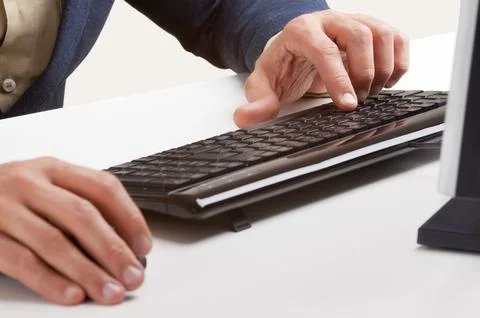 Businessman typing in a computer keyboard 写真素材