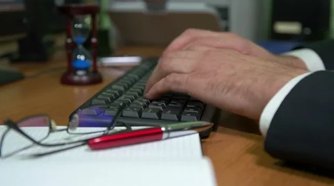 Businessman typing on a keyboard Stock Footage 68770995