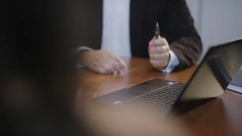 Businessman Typing on Laptop and Holding Pen, Modern Office Desk, Medium Shot Video stock 341574436