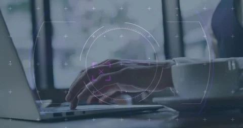 Businessman typing on laptop for data entry with HUD overlay tracking smartphone Stock Footage 318544942