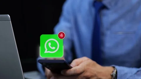 Businessman Typing Message On His Mobile Phone - WhatsApp Icon With Stock Footage 317553398