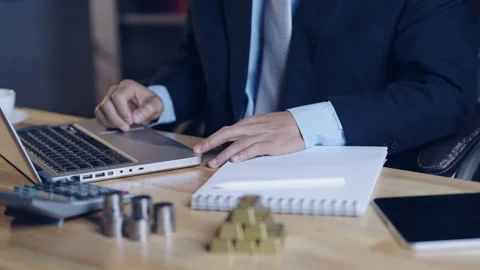 Businessman typing password on laptop for security access to online trading.. Stock Footage 328440348