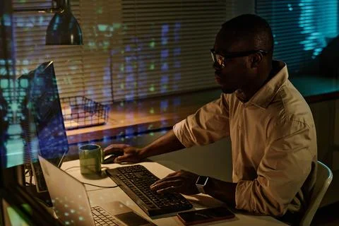 Businessman typing security codes on computer Stock Photos