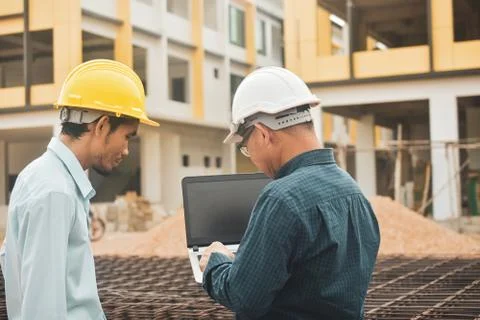 Businessman use computer talking on work site estate building construction Stock Photos