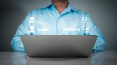 Businessman use computer technology to type live chat with intelligent comp.. Stock Photos