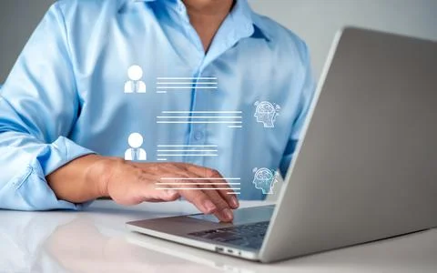 Businessman use computer technology to type live chat with intelligent comp.. Stock Photos