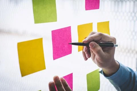 Businessman use post it notes to planning idea and business marketing strateg Stock Photos