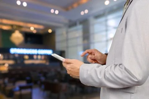 Businessman Use Wireless Tablet Device in Restaurant with Bokeh Stock Photos