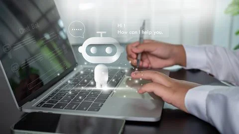 Businessman uses computer to type chat question and answer with artificial .. Stock Photos