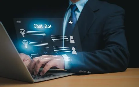 Businessman uses computer to type chat Ask and answer with the artificial i.. Stock Photos