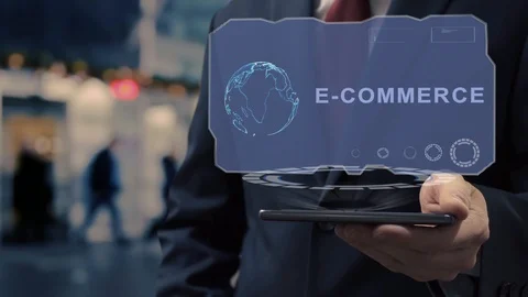 Businessman uses hologram E-commerce Stock Footage 123447554