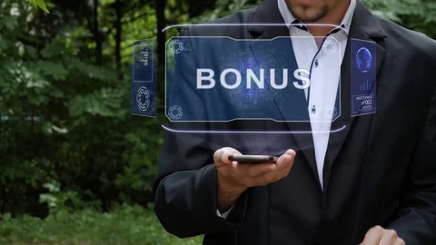 Businessman uses hologram with text Bonus Stock Footage