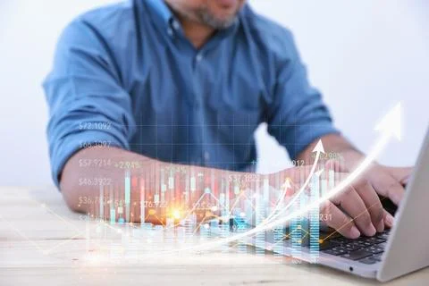 Businessman uses laptop computer for analysis growth graph chart of corpora.. Stock Photos